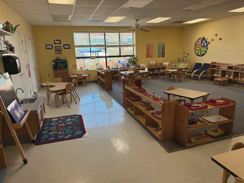 A bright Early Childhood classroom with low shelves