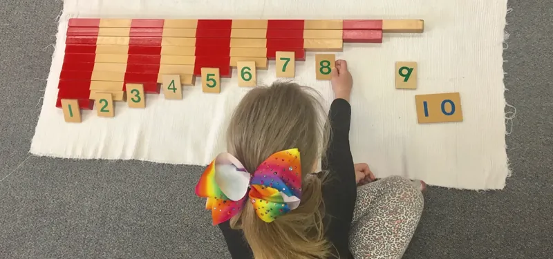 A child counting with the number rods